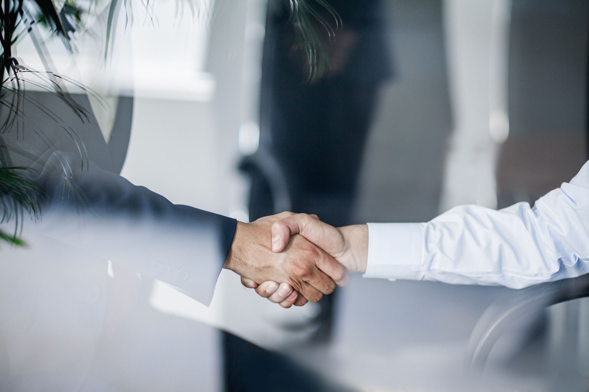 Handshake between salesperson and client
